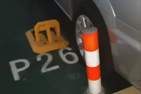 问政海南 | 安装地锁、立柱 海口一小区开发商为防止未购车位业主停车出奇招图片