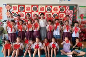 大连瓦房店：非遗剪纸成孩子们的新衣裳图片