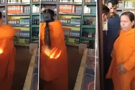 印度官员大闹酒馆：欢呼声中朝门店扔砖头 要求政府关店图片