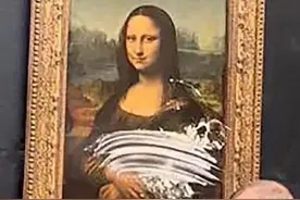 突发！达·芬奇名画《蒙娜丽莎》被人抹了蛋糕图片
