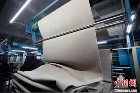 江北最大的毛呢布料生产基地实现面料“减肥瘦身”图片