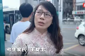 特写丨明德中学考生家长拖着行李箱送考：人生就像一条线，高考只是其中一个点图片