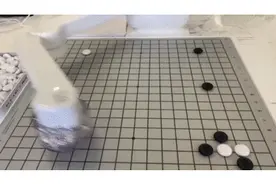 与AI对弈：商汤科技推出围棋机器人，手眼协同自由取子图片