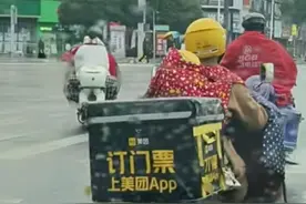 网友发布“女骑手带娃送餐”视频引网友感动，当事人：我骑车带孙回家图片