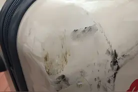 吉祥航空旅客称托运损坏限量版行李箱只赔500元！航司回应图片