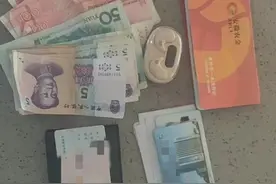 路边捡到钱包，环卫女工报警急寻失主图片