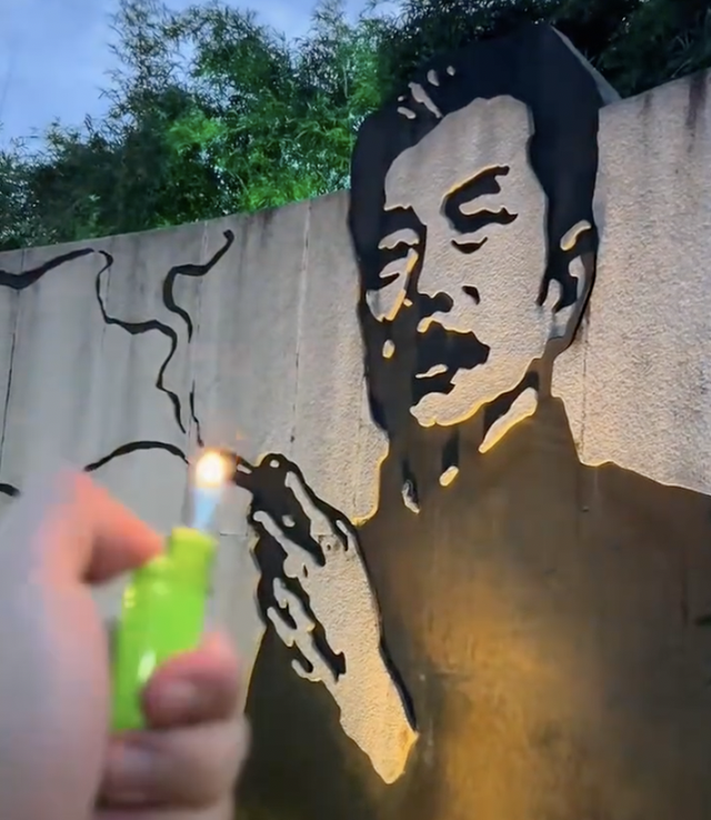 当地称不会因投诉盲目换鲁迅夹烟墙画